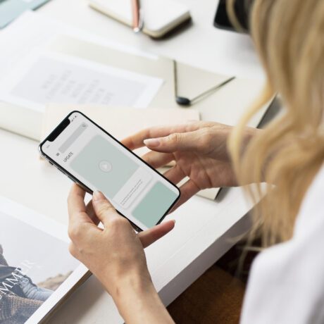 Fashion stylist using a mobile phone mockup at work