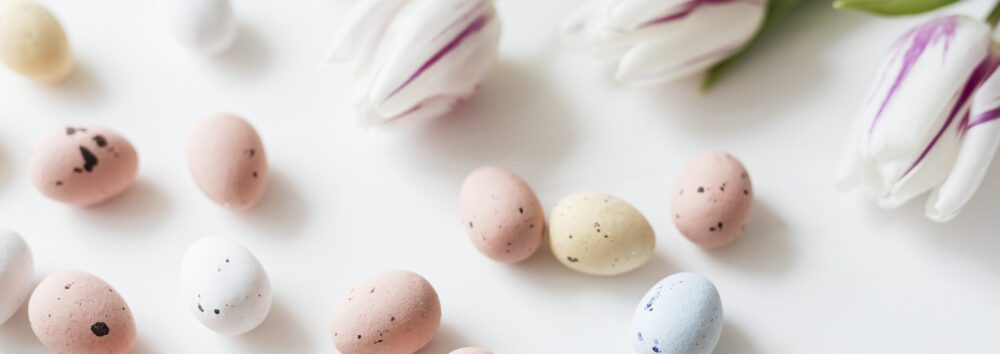Chocolate Easter eggs and tulips flatlay