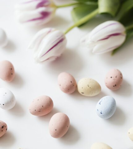 Chocolate Easter eggs and tulips flatlay