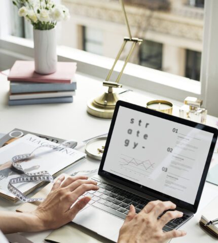 Businesswoman working on laptop mockup