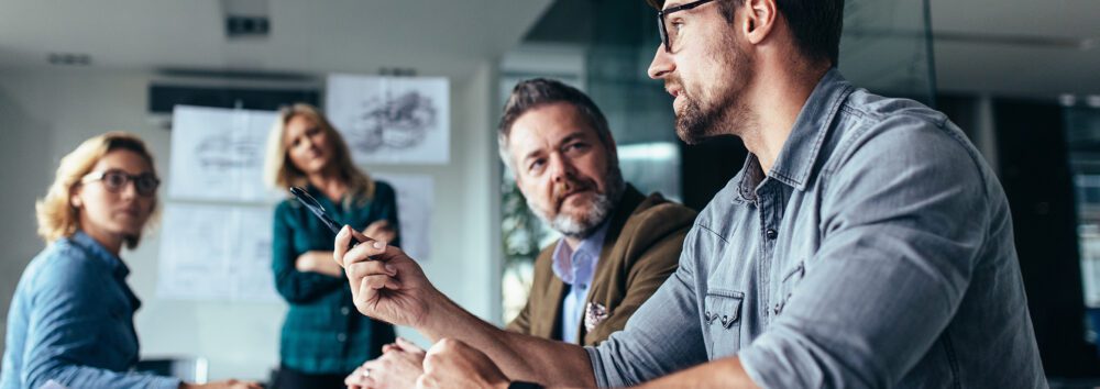 Young,Designer,Giving,Some,New,Ideas,About,Project,To,His